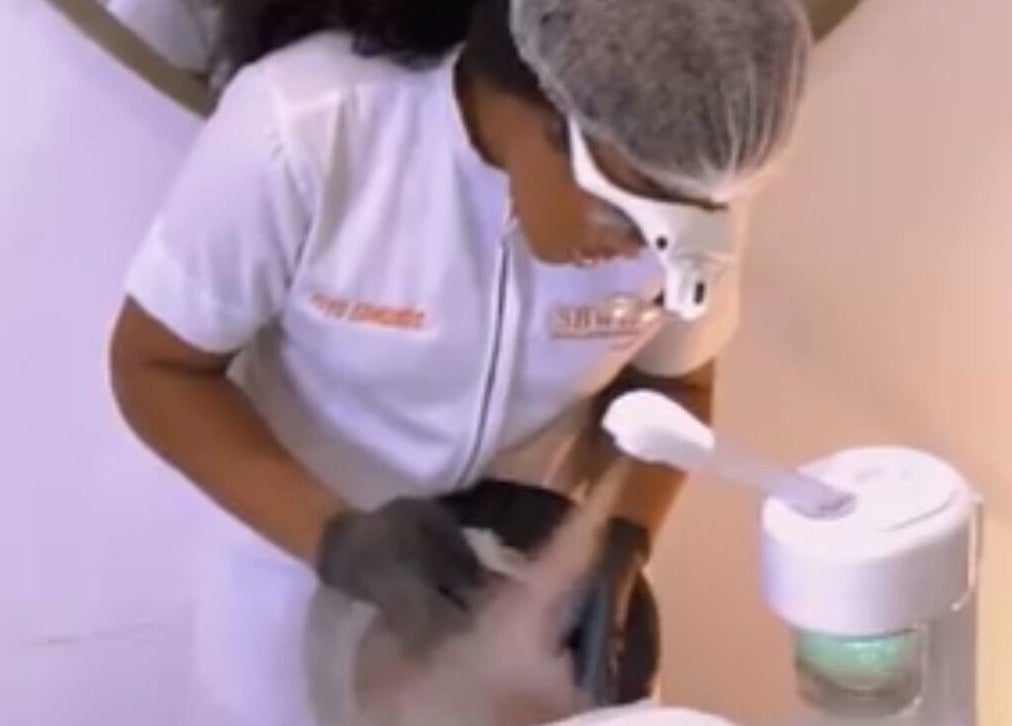 Spa professional in action at Sbwr - Virtual Esthetic Clinic & Mobile Spa, Lagos, NG, offering expert facial care.
