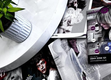 Stylish magazines and a plant at ZS Hair & Beauty, Welling, England, GB, showcasing beauty trends.