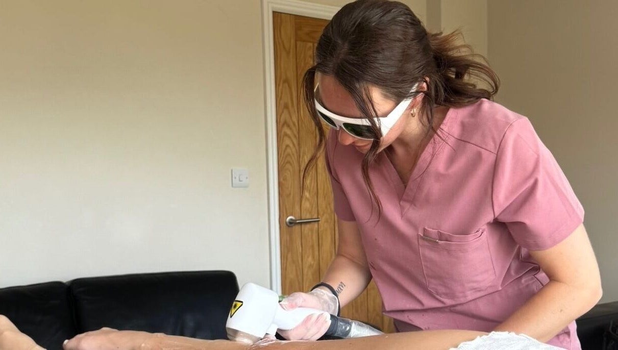 Aesthetician performing laser treatment at Illuminate Mobile Clinic in Bramley, England, GB.