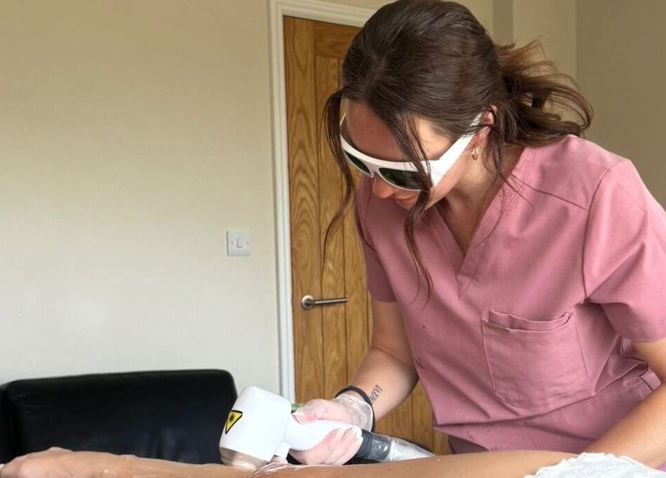 Aesthetician performing laser treatment at Illuminate Mobile Clinic in Bramley, England, GB.