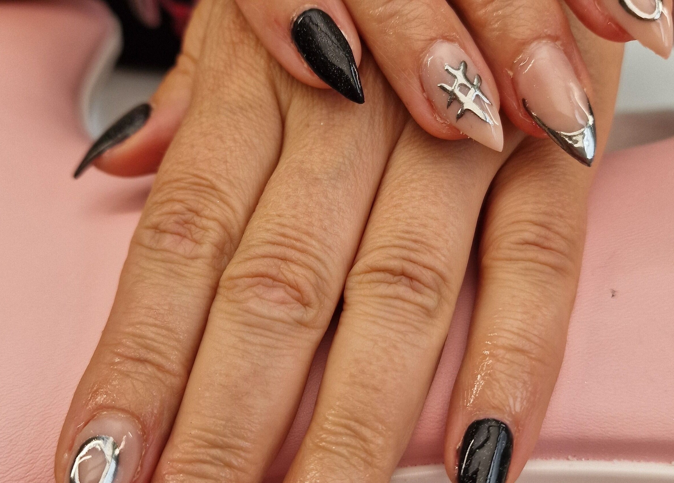 Elegant black and silver nail art at Glamour Nails Telford, Telford, England, GB, showcasing intricate detail.