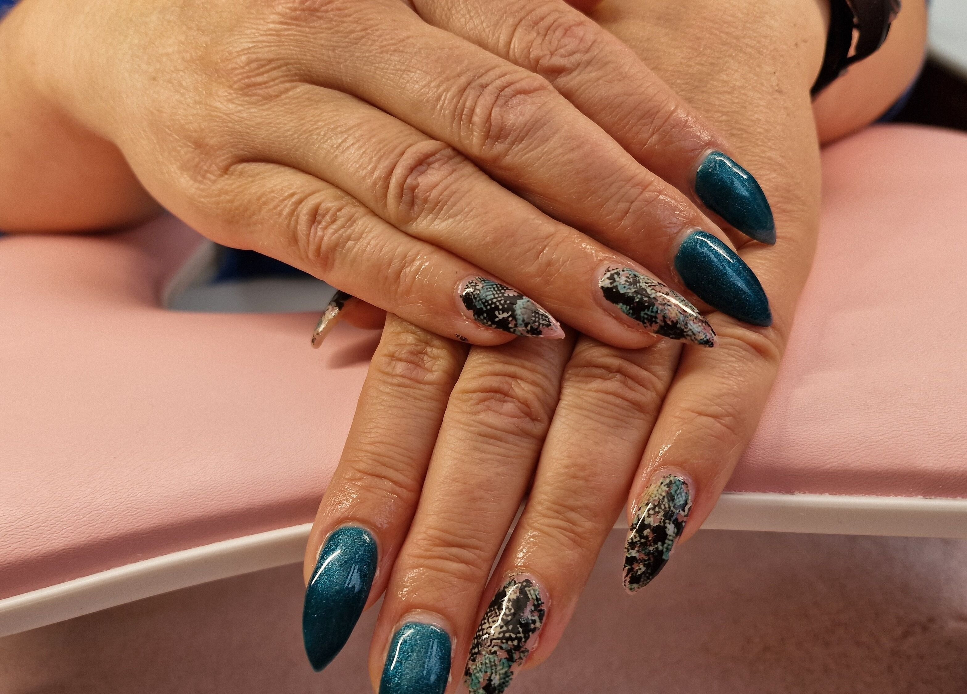 Stunning nail art at Glamour Nails Telford, Telford, England, GB showcasing intricate blue and marble designs.