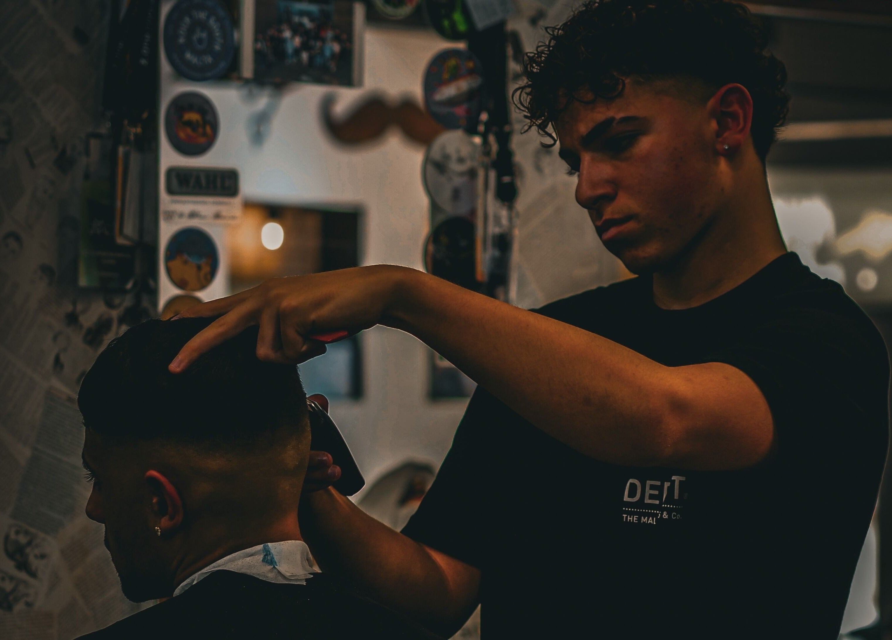Professional barber crafting stylish haircut at Yuva by Clinton, Ħaż-Żebbuġ, MT.
