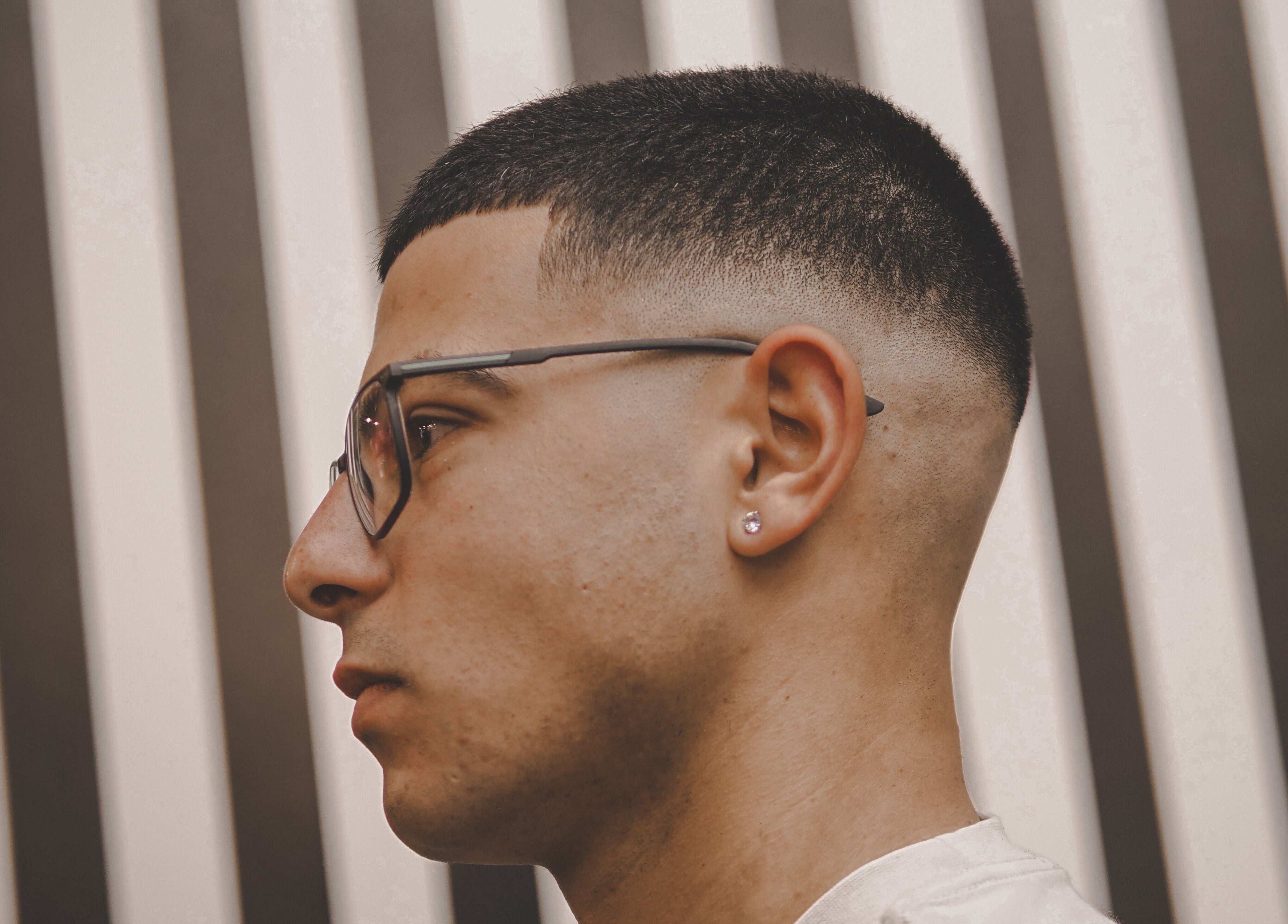 Close-up side view of a stylish fade haircut at Yuva by Clinton, Ħaż-Żebbuġ, MT.