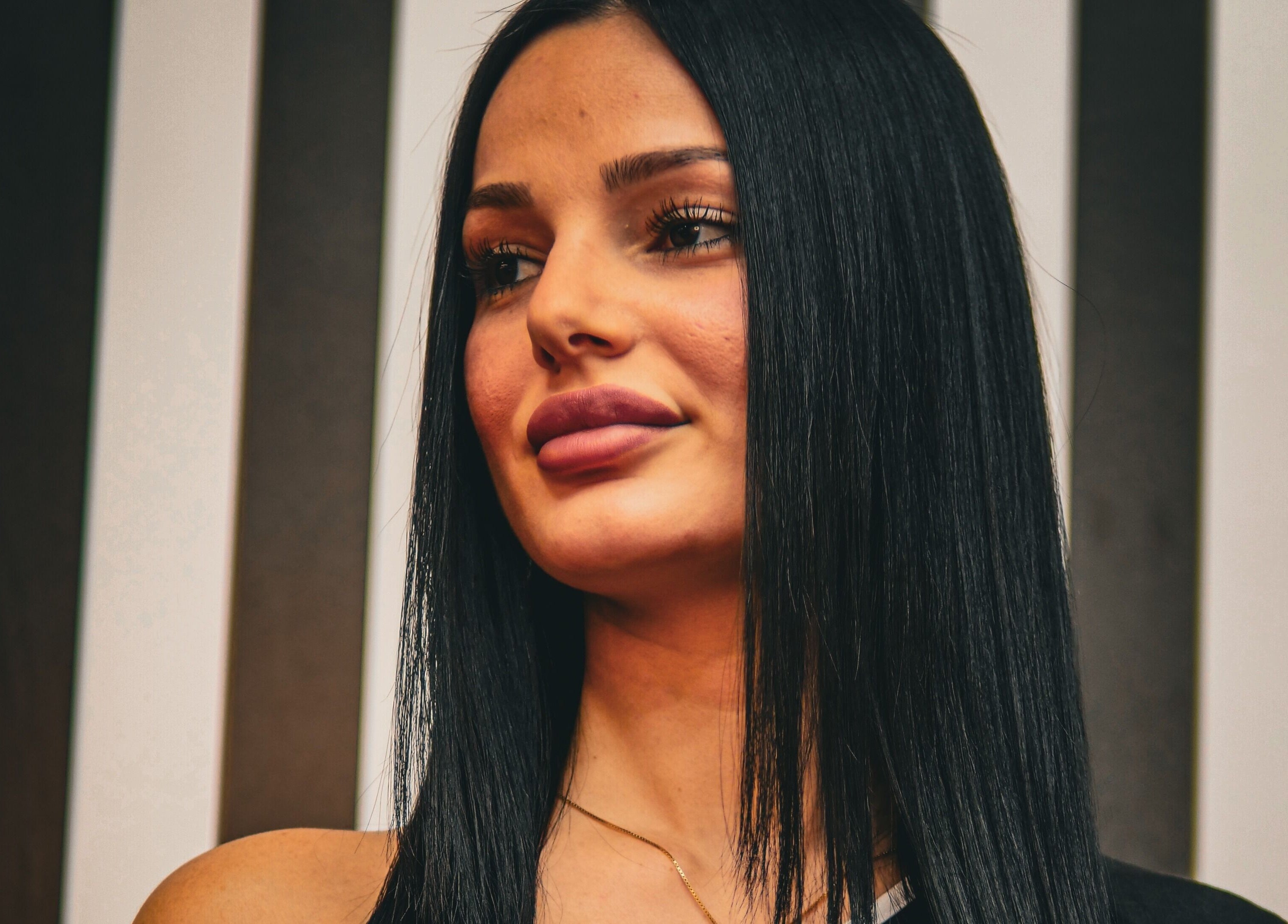 Portrait of a woman with sleek hair at Yuva by Clinton, Ħaż-Żebbuġ, MT, showcasing beauty style.