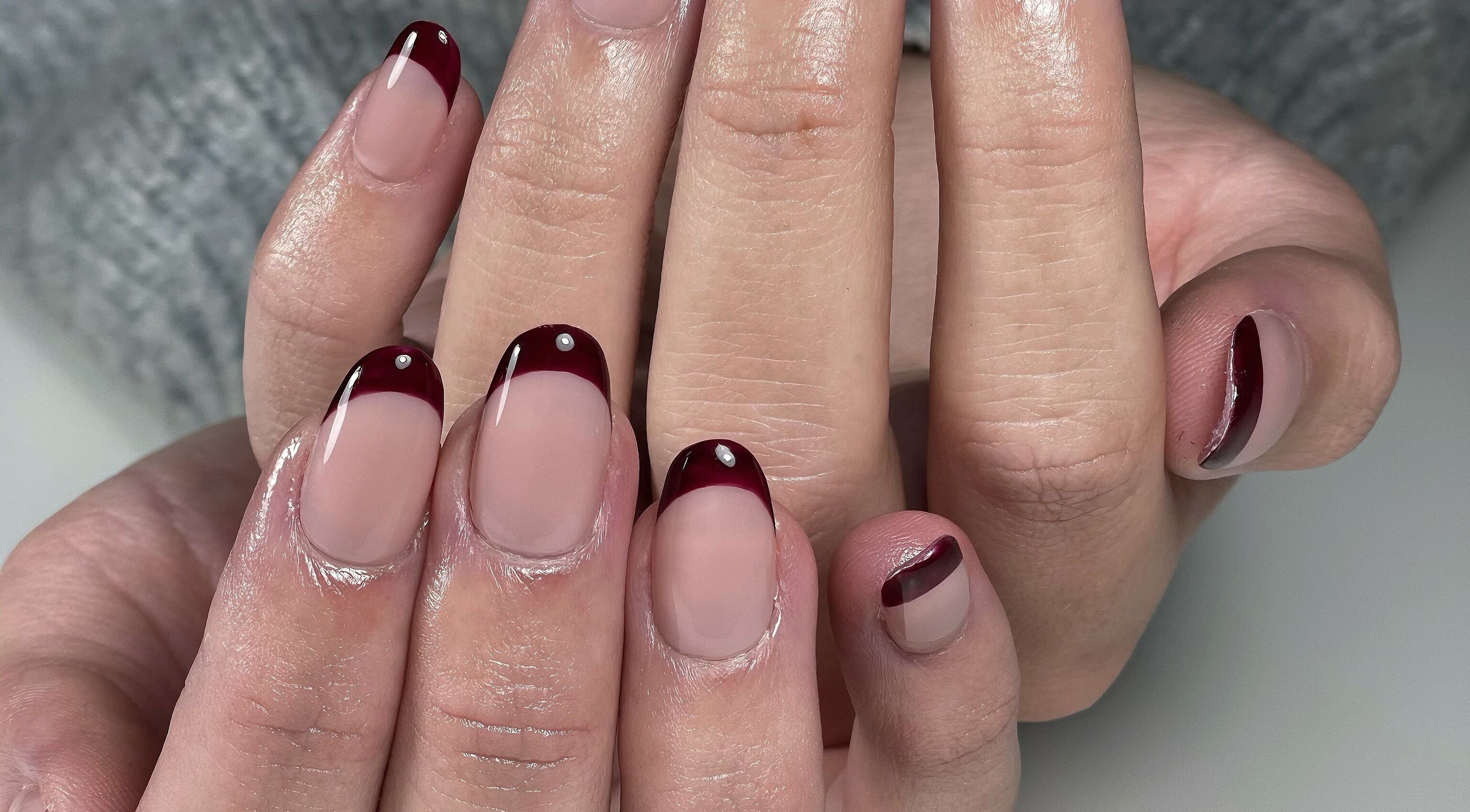 Burgundy French manicure done at AK Nails in Toowoomba City, Queensland, AU showcasing elegance and style.