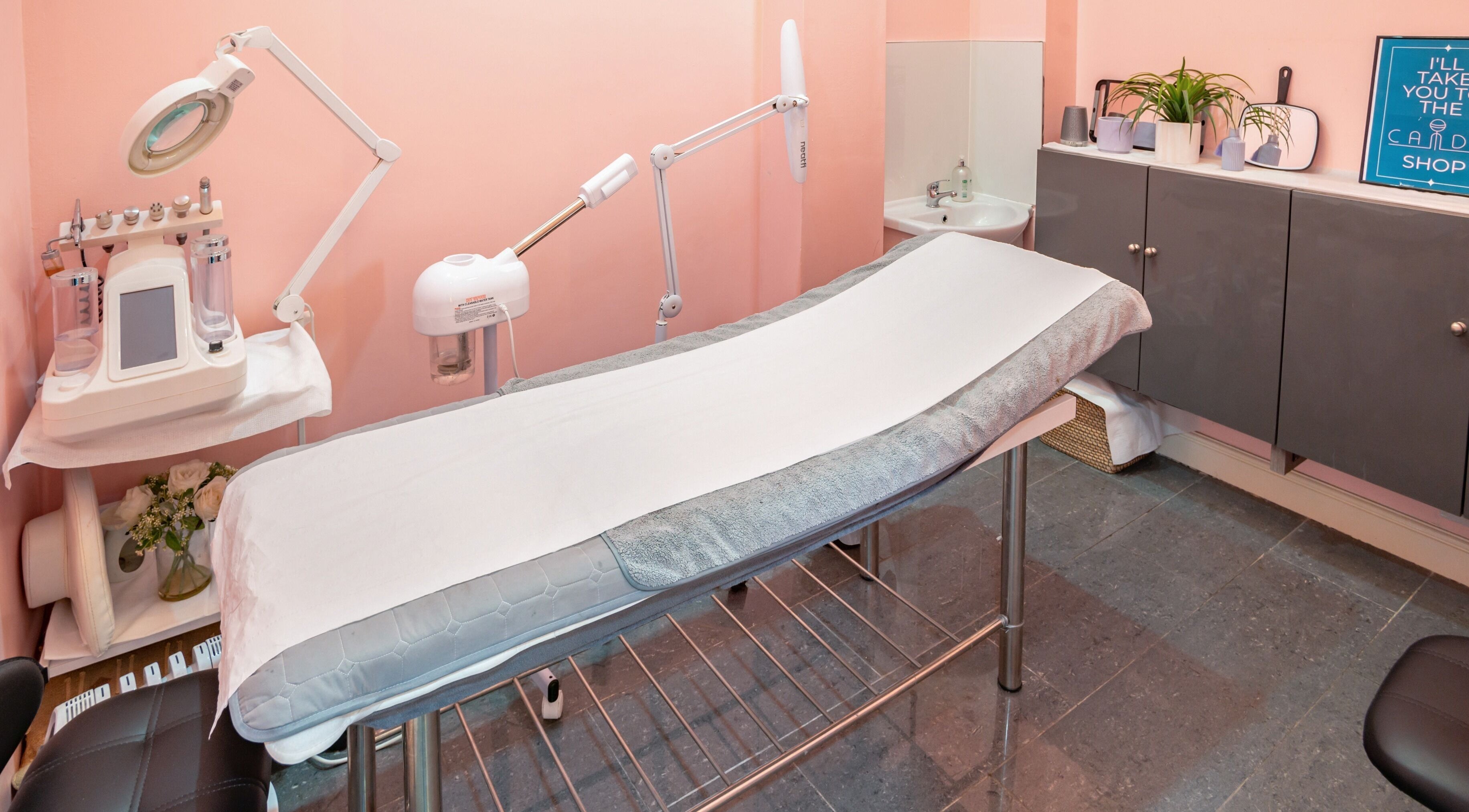 Relaxing treatment room at Candy Wanstead, London, England. Sleek design with modern equipment for a serene experience.