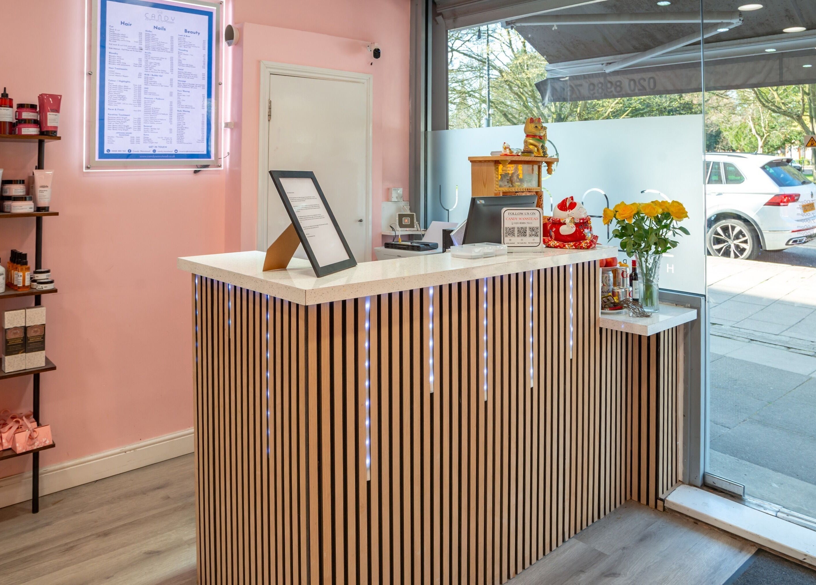 Welcoming reception at Candy Wanstead, London, England, GB, with modern decor and vibrant product displays.