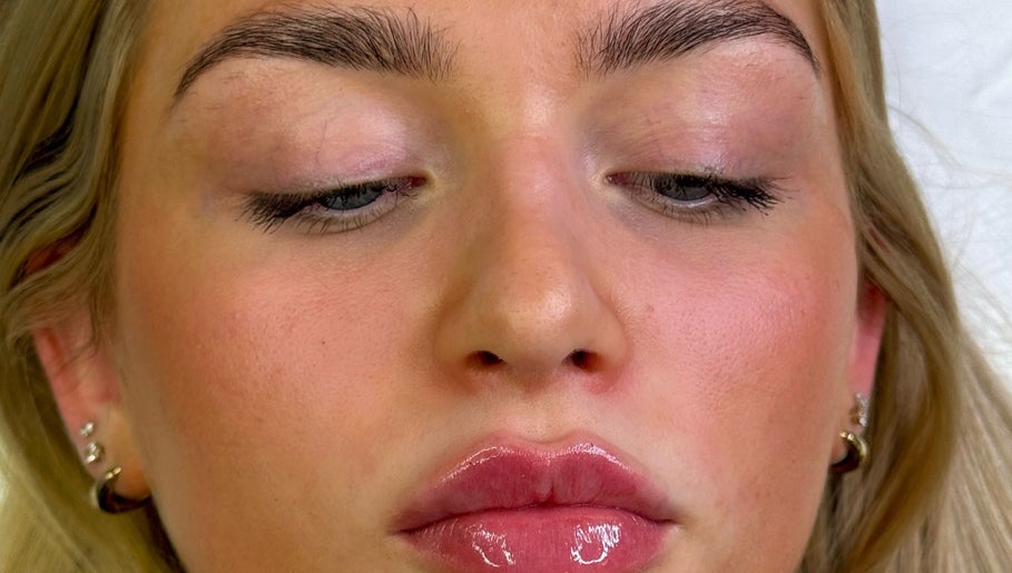 Close-up of radiant skin and glossy lips at Facedate Studio, Whalley, England, GB.
