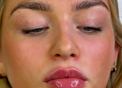 Close-up of radiant skin and glossy lips at Facedate Studio, Whalley, England, GB.