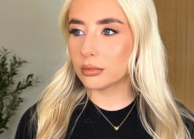 Blonde woman with flawless makeup at Facedate Studio, Whalley, England, GB. Natural beauty showcased.