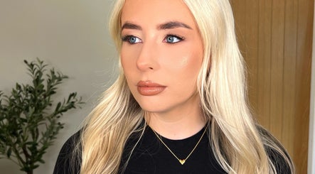 Blonde woman with flawless makeup at Facedate Studio, Whalley, England, GB. Natural beauty showcased.