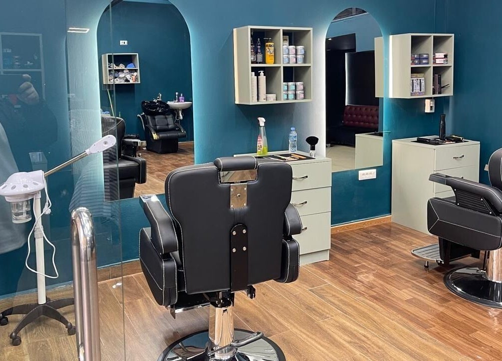 Fade Factory's sleek interior with modern barber chairs in Tiranë, Tirana County, AL.