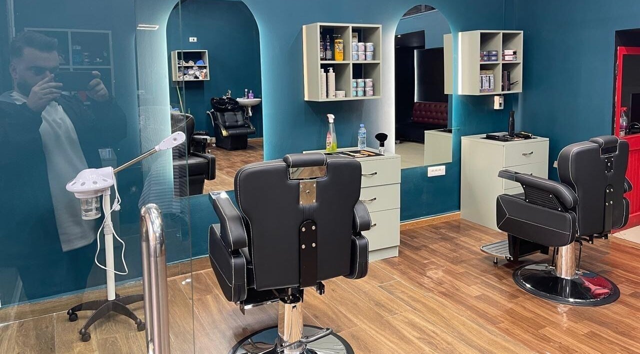 Fade Factory's sleek interior with modern barber chairs in Tiranë, Tirana County, AL.