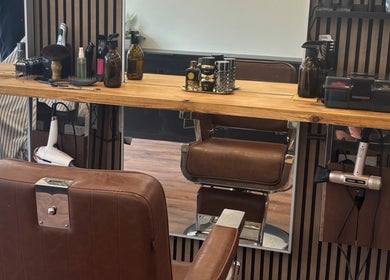 Stylish barber chair at Jodie Jago Barber, Burscough, England, GB showcasing elegant salon setup.