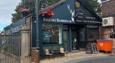 Exterior of Jodie Jago Barber in Burscough, England, showing inviting shopfront and outdoor seating.
