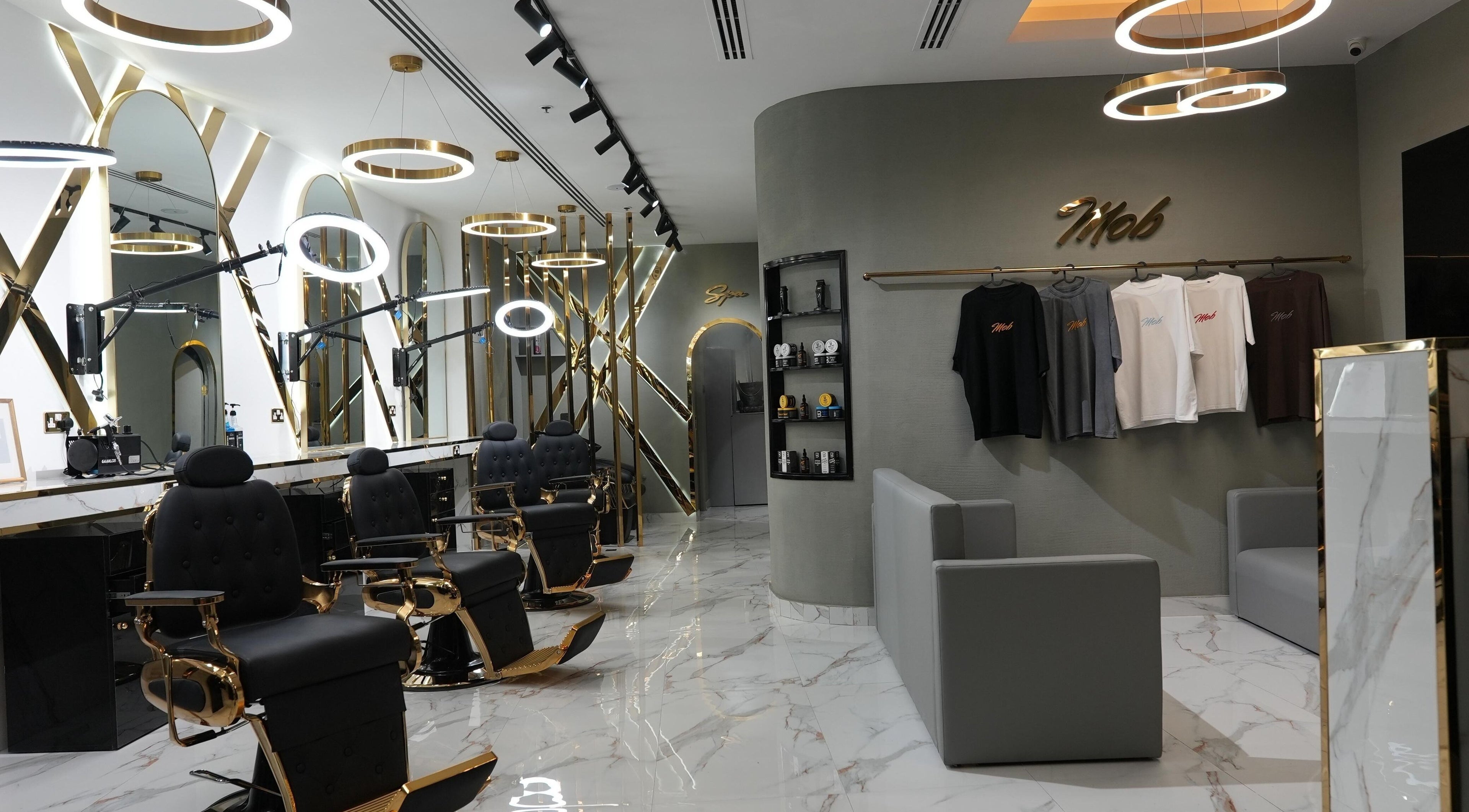 Sophisticated interior of Barber club Spa by Oussbarber in Dubai, Dubai, AE with stylish chairs and decor.