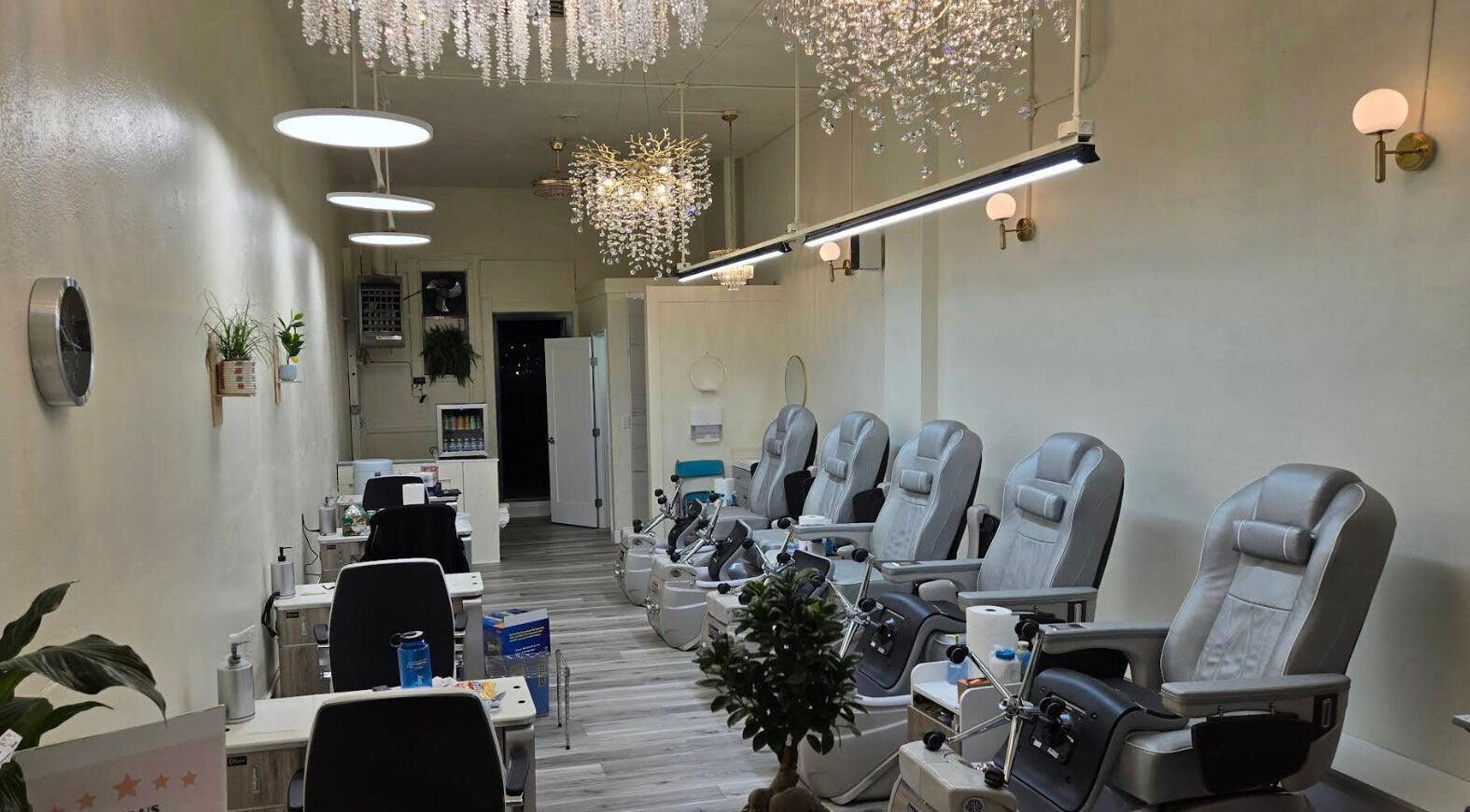 Elegant nail salon interior at Wash Park Nails, Denver, Colorado, US, featuring sleek chairs and modern decor.