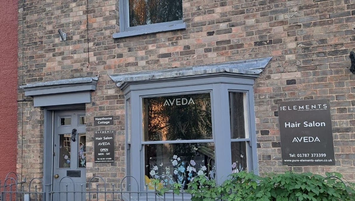 Exterior of Pure Elements hair salon in Long Melford, England, GB displaying Aveda signage.
