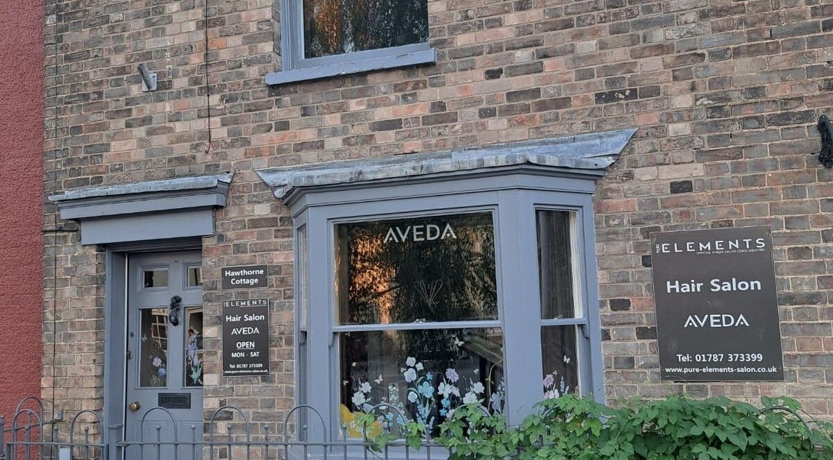 Exterior of Pure Elements hair salon in Long Melford, England, GB displaying Aveda signage.