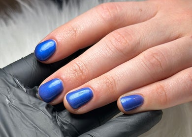 Vibrant blue manicure at Nail Studio 9, Kingskerswell, England, GB. Perfect nails for elegance seekers.
