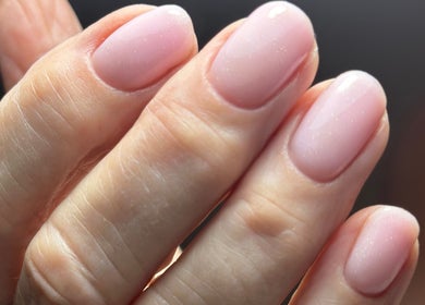 Manicured nails with soft pink polish at Nail Studio 9, Kingskerswell, England, GB.