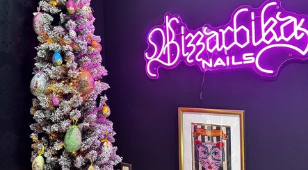 Festive decor beside Bizzarbika Nails neon sign in Zagreb, Grad Zagreb, HR, enhancing cozy vibe.