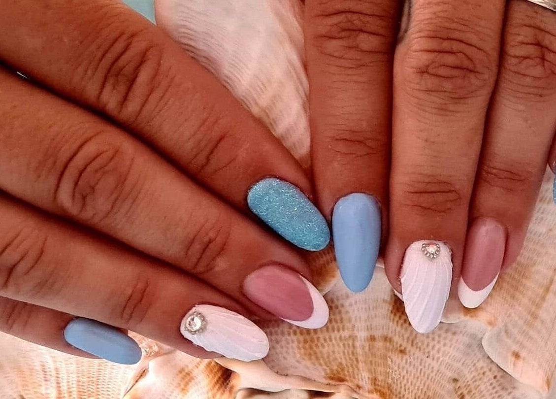 Elegant nail art in blue and pink at Beauty by Viv, Llandudno Junction, Wales, GB.