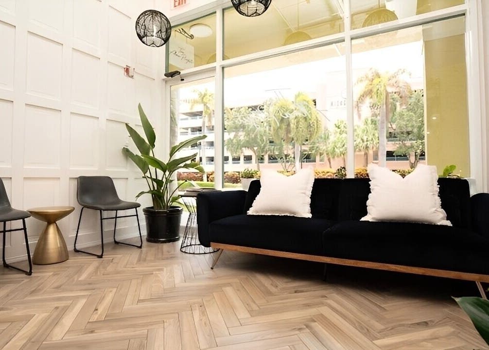 Modern lounge at Yani Mendez x Vion Salon in Boca Raton, Florida, US with sleek furniture and calming decor.