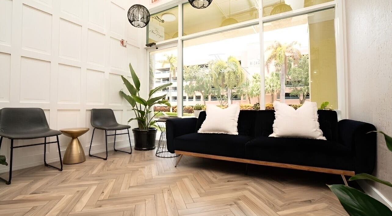 Modern lounge at Yani Mendez x Vion Salon in Boca Raton, Florida, US with sleek furniture and calming decor.