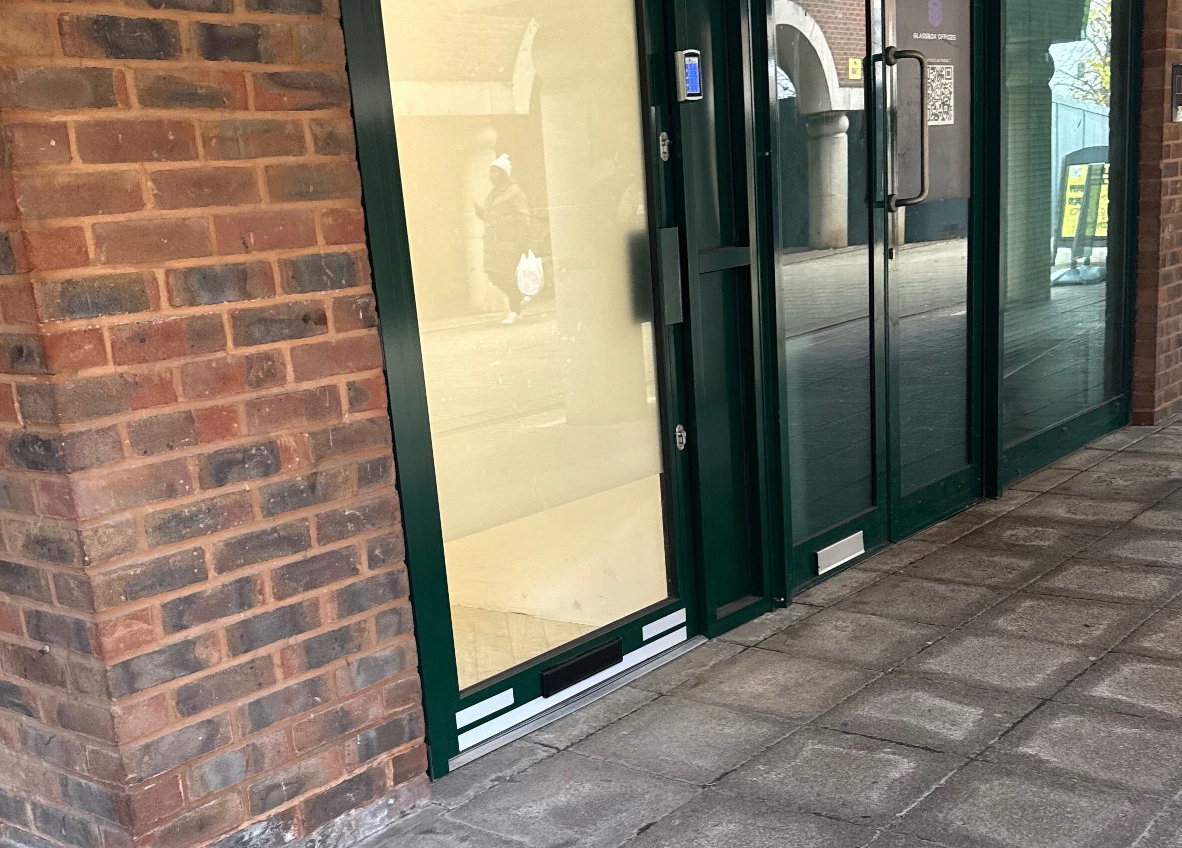 Entrance of Browtopia & Beyond | Halal Brows in London, England, GB with modern glass and brick exterior.