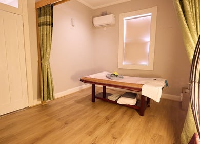 Calming massage room at Bodeze Traditional Thai Massage, Crows Nest, New South Wales, AU, featuring a comfortable table.