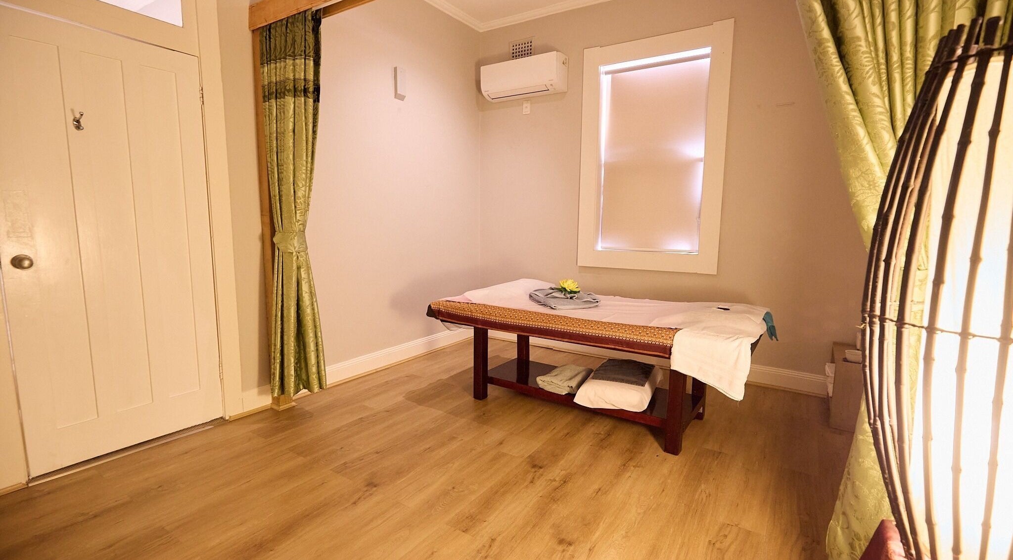 Calming massage room at Bodeze Traditional Thai Massage, Crows Nest, New South Wales, AU, featuring a comfortable table.