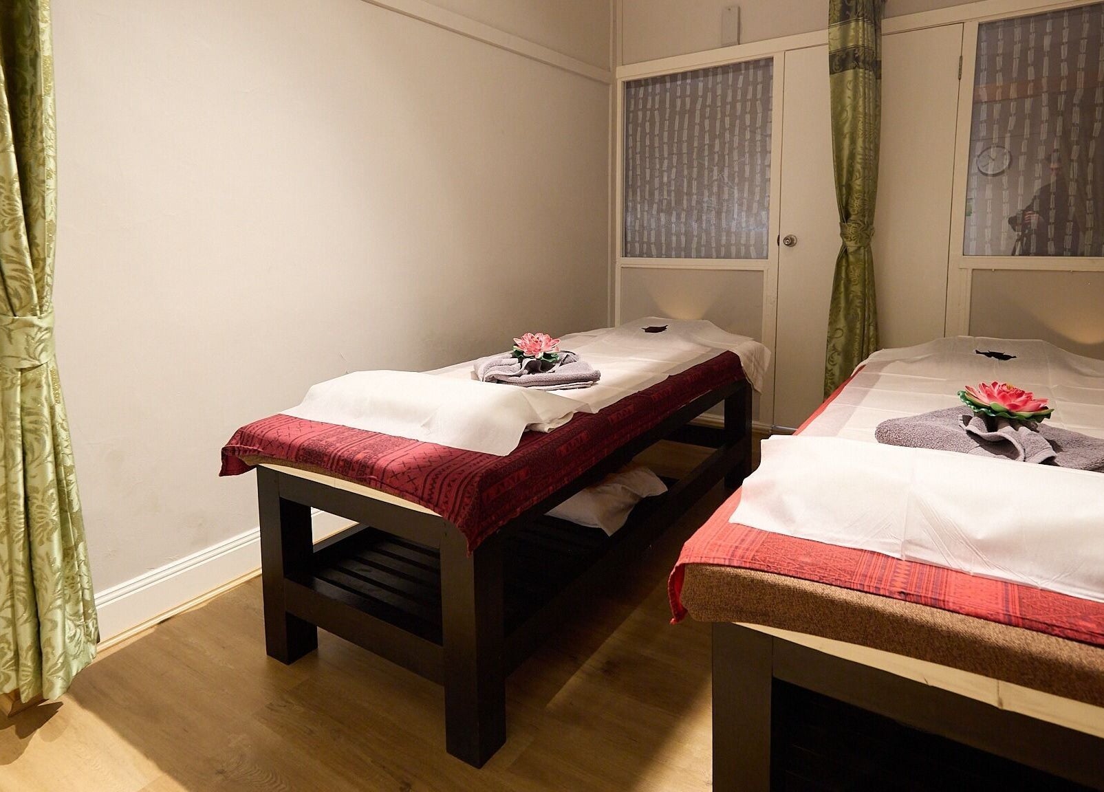 Tranquil massage room at Bodeze Traditional Thai Massage, Crows Nest, New South Wales, AU, with two massage beds.