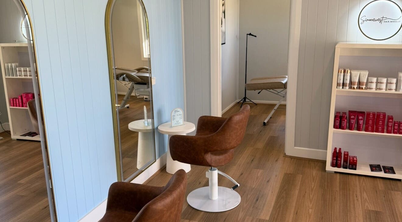 Elegant salon interior at Simone West Hair Makeup, Landsborough, Queensland, AU, featuring stylish chairs and products.