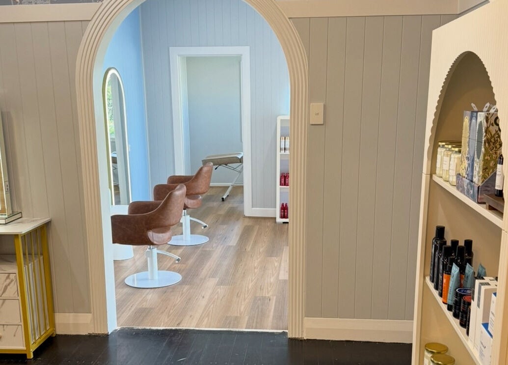 Elegant interior of Simone West Hair Makeup, Landsborough, Queensland, with modern chairs and tasteful decor.