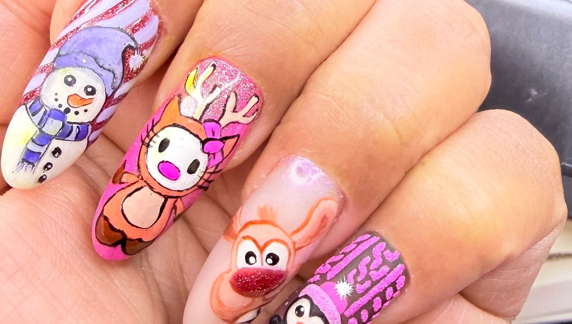 Vibrant festive nail art at Nit Sparkle Nail, Dublin, County Dublin, IE, featuring snowmen and reindeer designs.