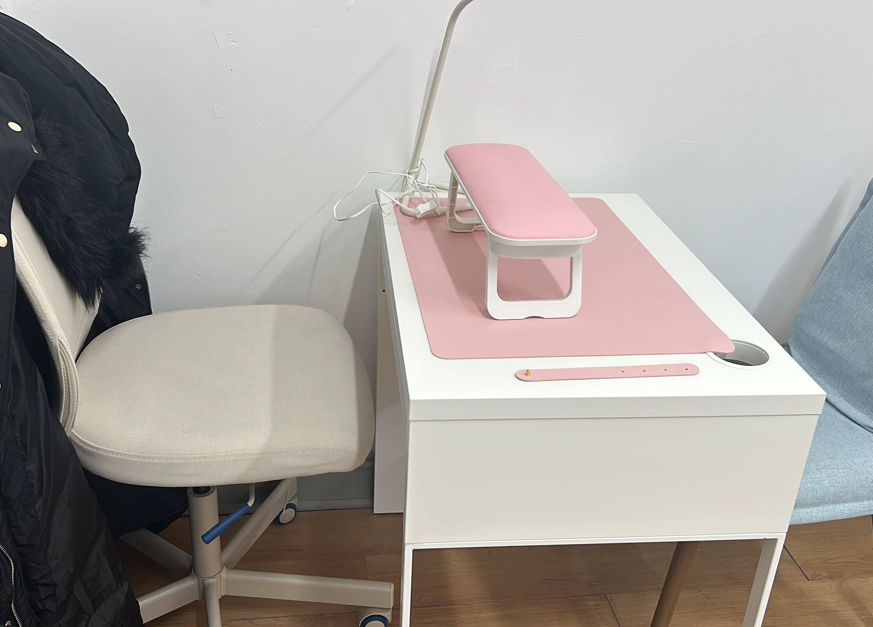 Minimalist nail station at Nit Sparkle Nail, Dublin, County Dublin, IE, with soft seating and modern decor.