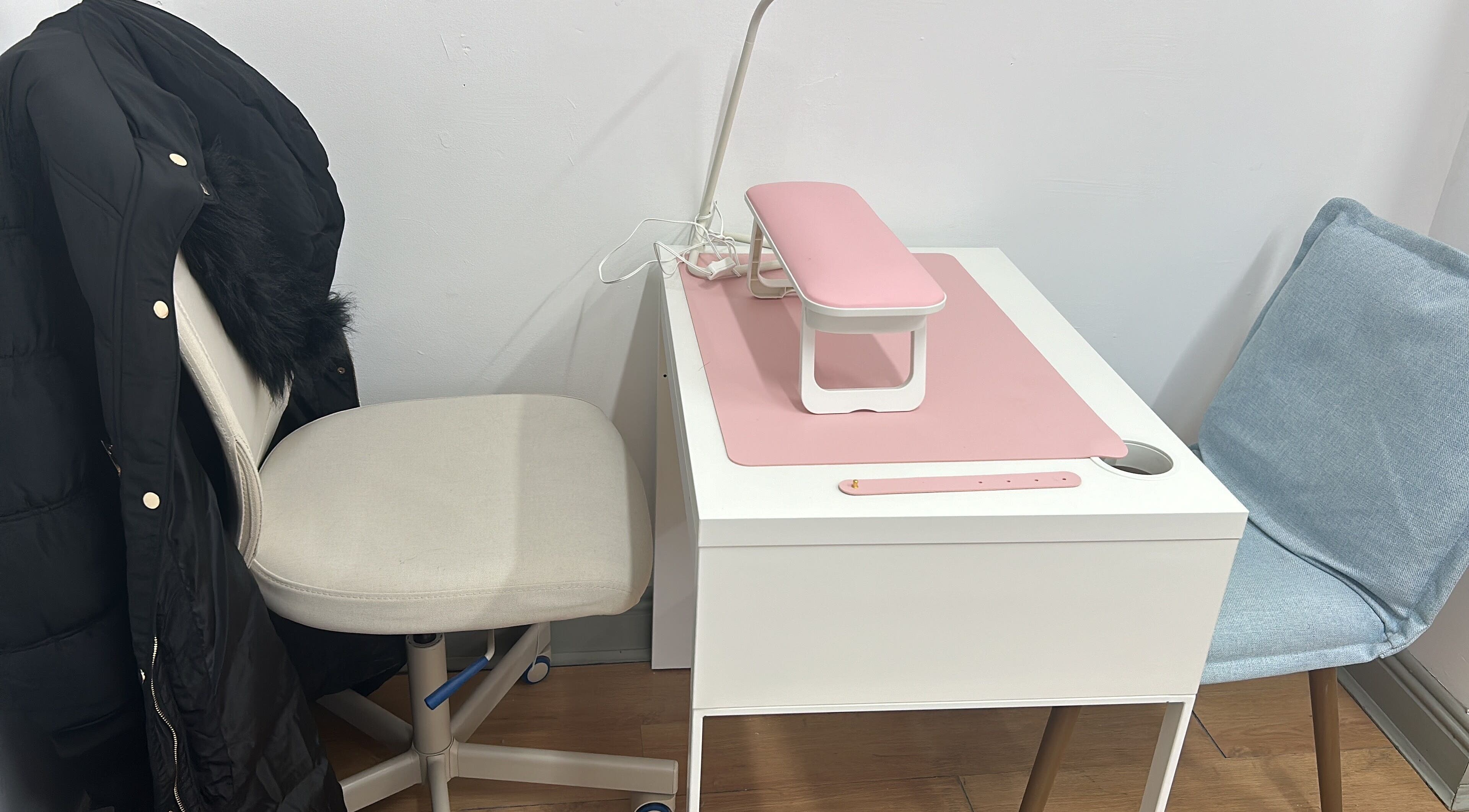 Minimalist nail station at Nit Sparkle Nail, Dublin, County Dublin, IE, with soft seating and modern decor.