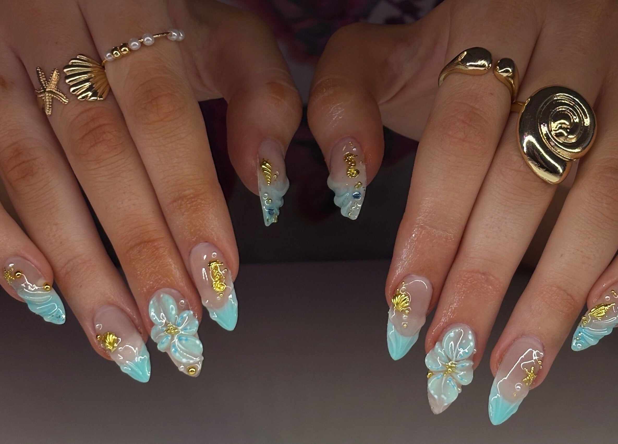 Intricate nail art with ocean theme at Mochiimanii in Yeronga, Queensland, AU. Blue and gold accents.