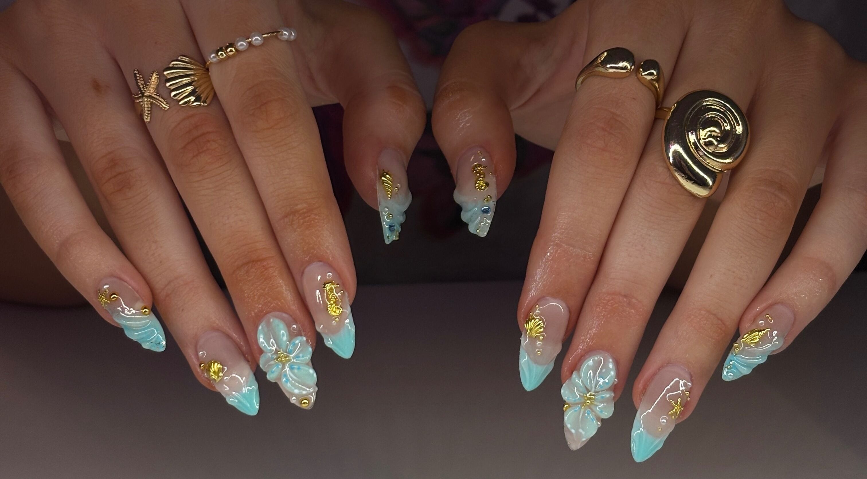 Intricate nail art with ocean theme at Mochiimanii in Yeronga, Queensland, AU. Blue and gold accents.