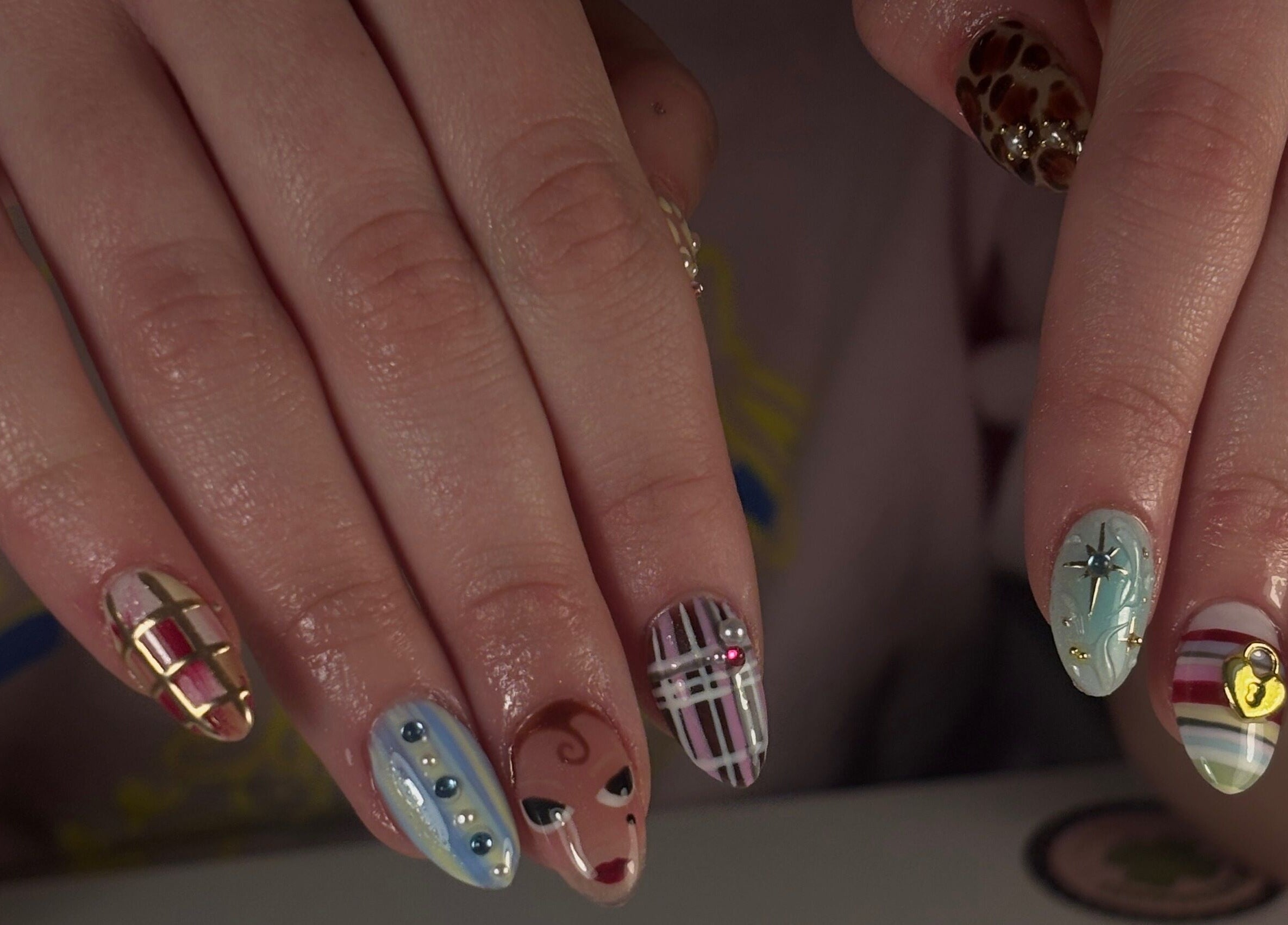 Intricate nail art designs at Mochiimanii, Yeronga, Queensland, AU showcase colorful creativity and style.