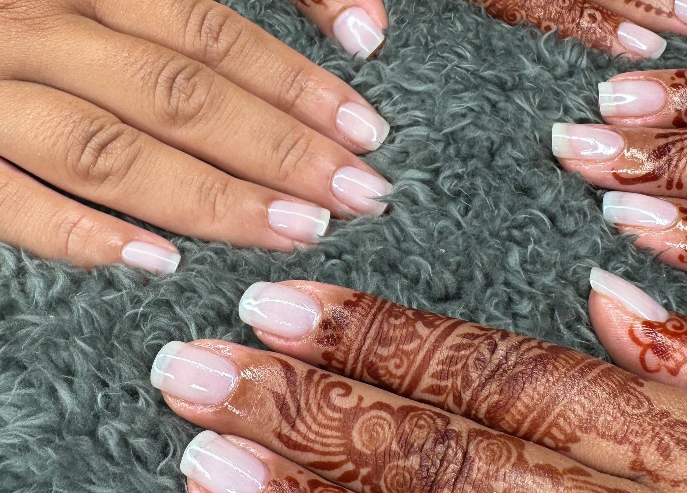 Elegant nail art with henna at Mani.festation.nbt, Mountsorrel, England, GB. Showcasing delicate manicure styles.