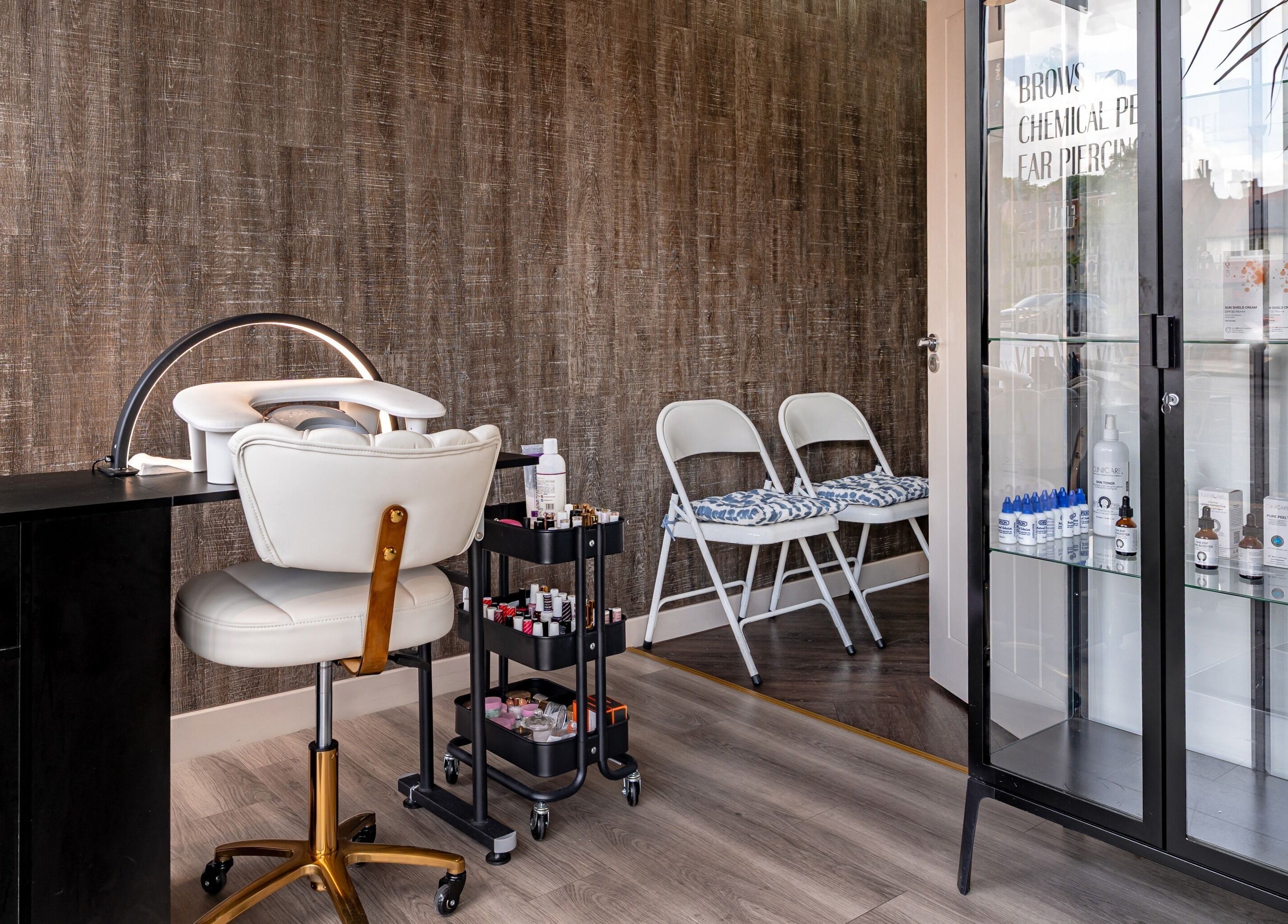 Stylish manicure station at It's Angies, London, England, GB with polished equipment and elegant decor.