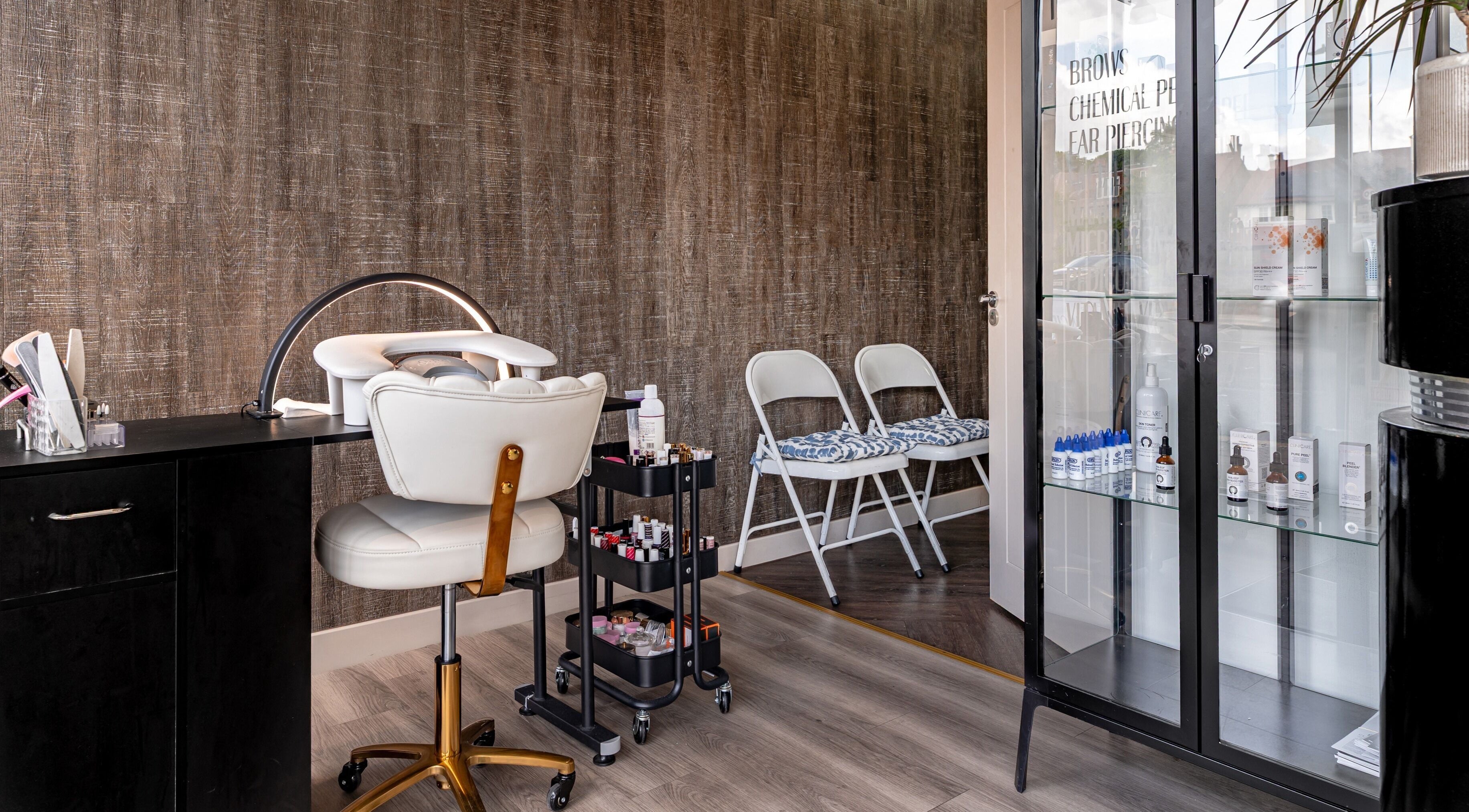 Stylish manicure station at It's Angies, London, England, GB with polished equipment and elegant decor.