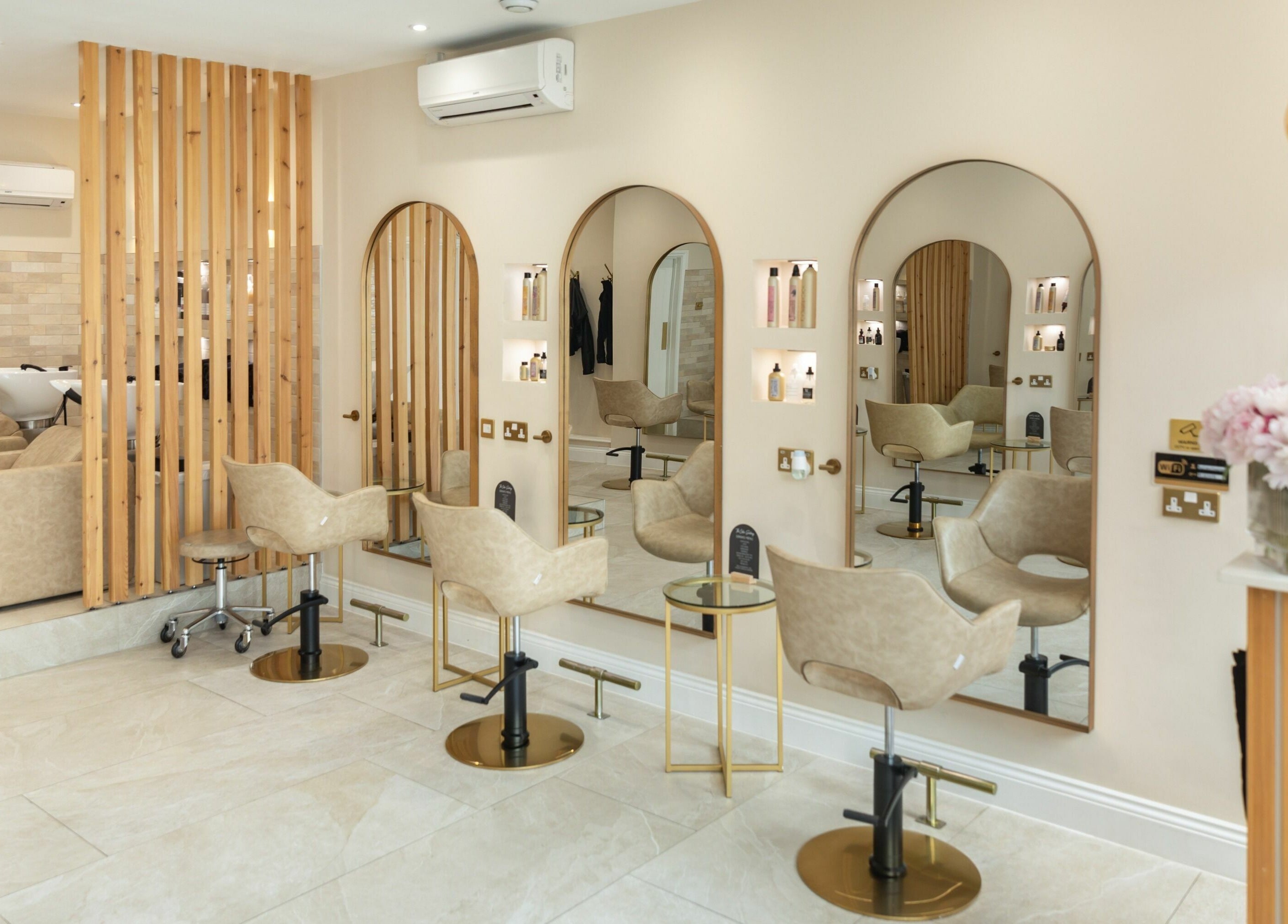 Elegant salon chairs and mirrors at The Colour Sanctuary, Crowborough, England, GB offering a tranquil vibe.