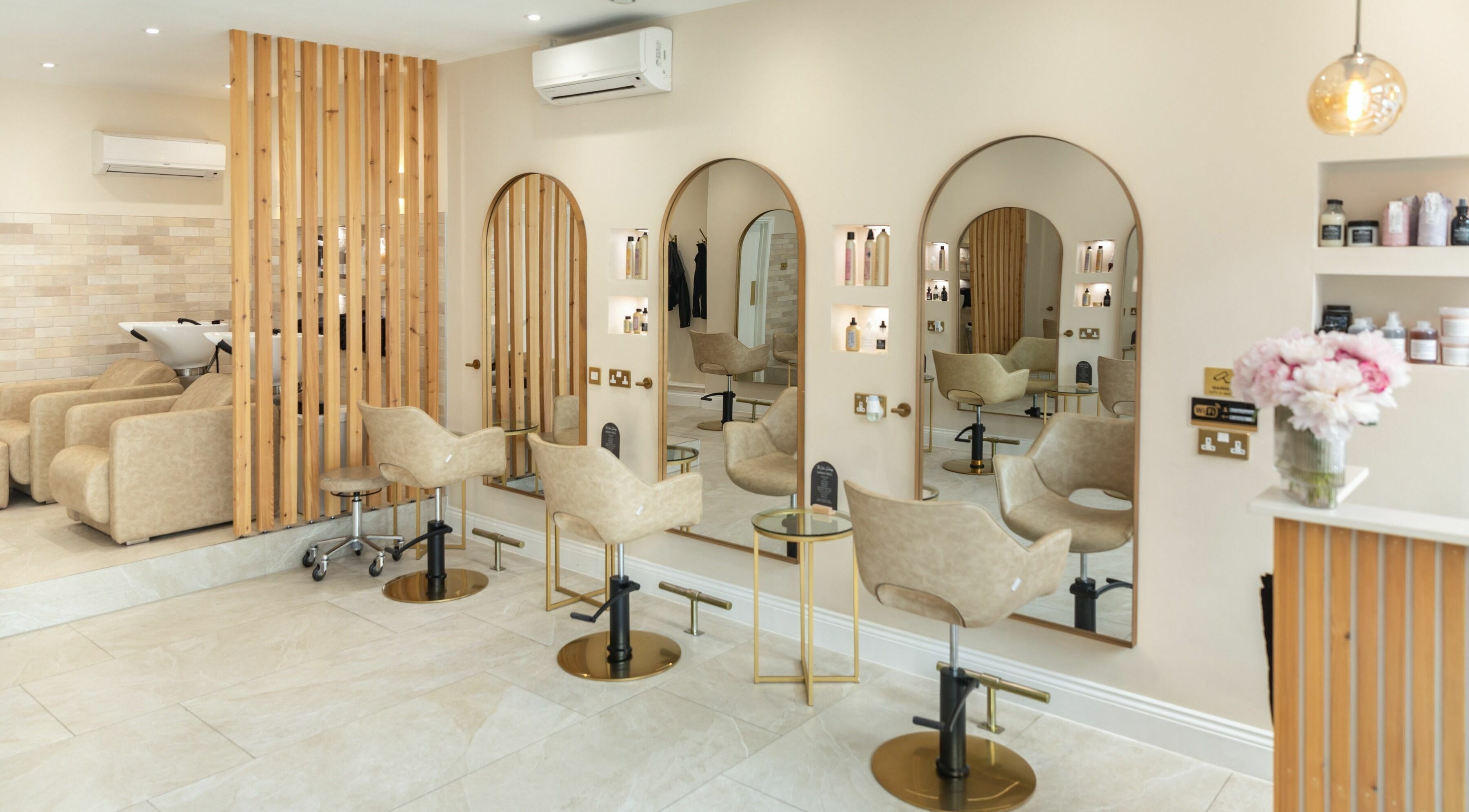Elegant salon chairs and mirrors at The Colour Sanctuary, Crowborough, England, GB offering a tranquil vibe.