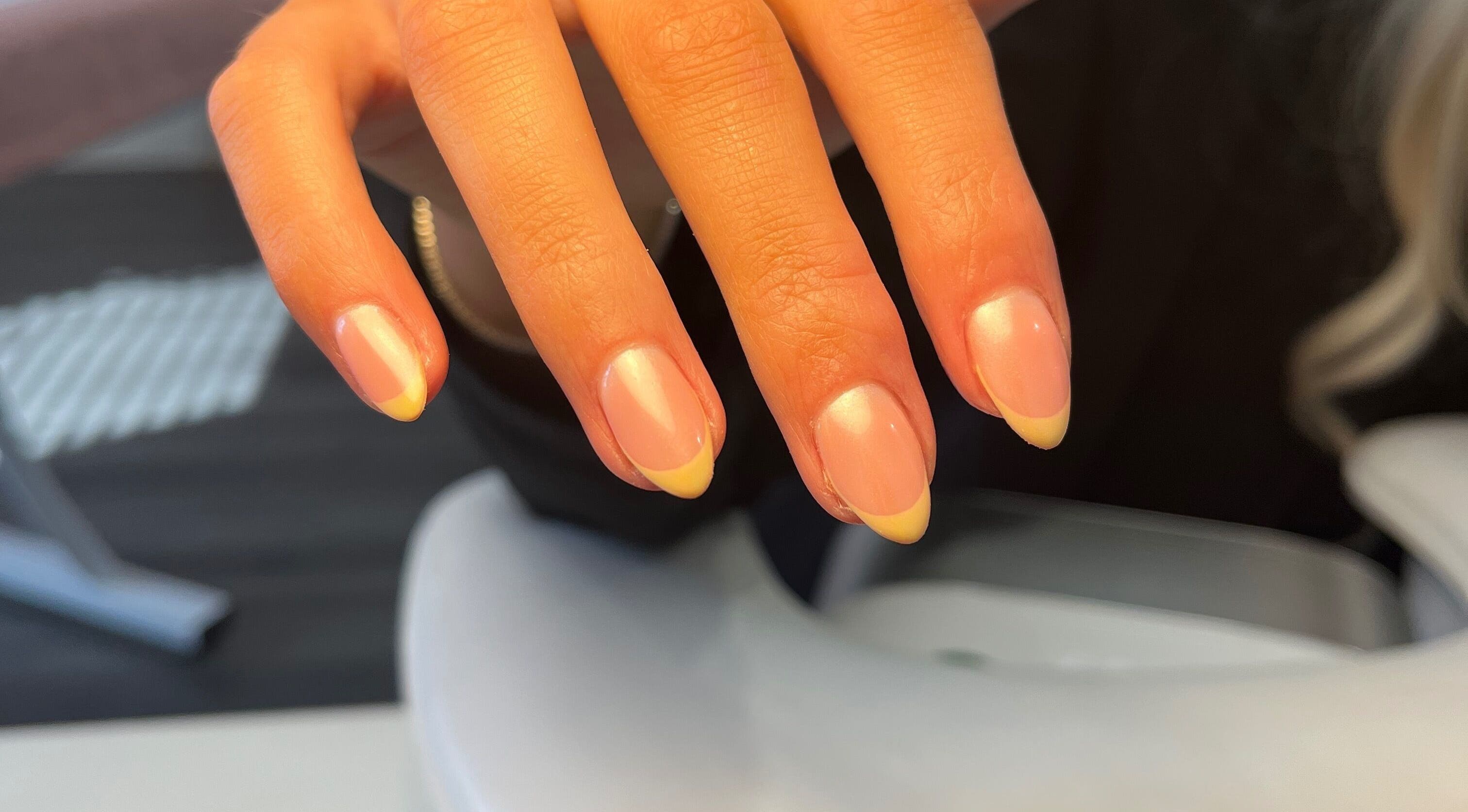 Elegant French manicure at Ella W Smith Beauty, Clayton-le-moors, England, GB. Perfectly polished nails.