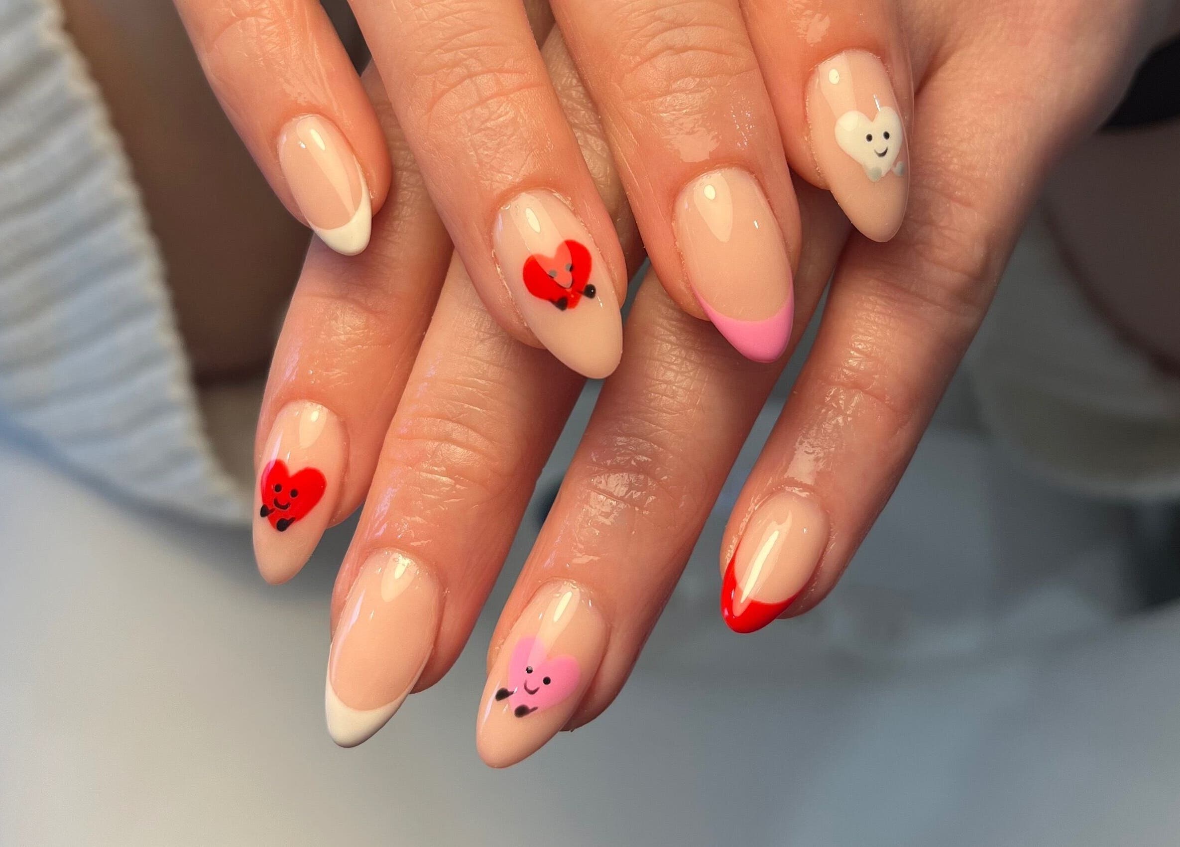 Heart-themed nail art at Ella W Smith Beauty, Clayton-le-moors, England, GB showcasing creativity and elegance.