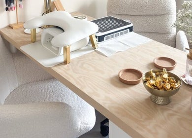 Gloss by Storm's elegant nail station at Bowbrook, England, GB, featuring comfort chairs and manicure tools.